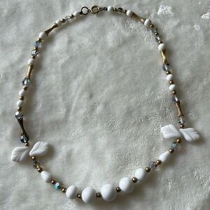 White beaded necklace.